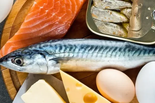 AdobeStock_382448032 A spread of fish, mushrooms, eggs and dairy products - key sources of vitamin D.