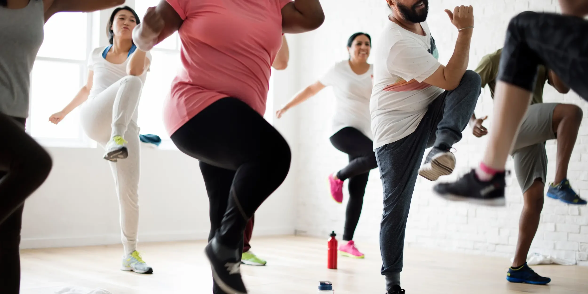 How to improve joint health An exercise class engages in aerobic exercise indoors.