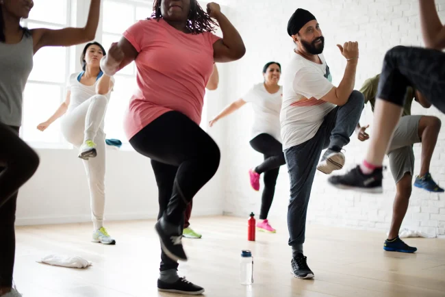 How to improve joint health An exercise class engages in aerobic exercise indoors.