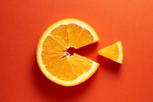 What are the benefits of vitamin C A flat slice of orange with one segment removed to make a ‘C’ shape.
